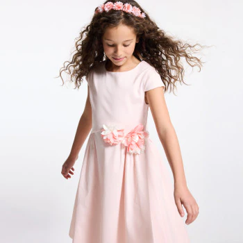 Girl's pink dress with cut-out flowers