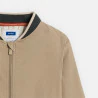 Boy's beige fabric baseball jacket.