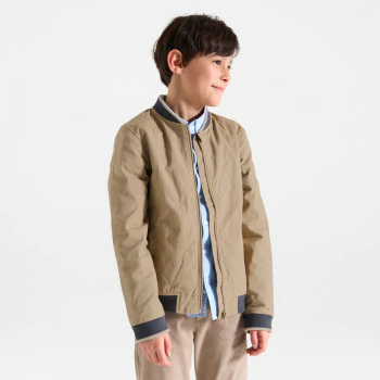 Boy's beige fabric baseball jacket.